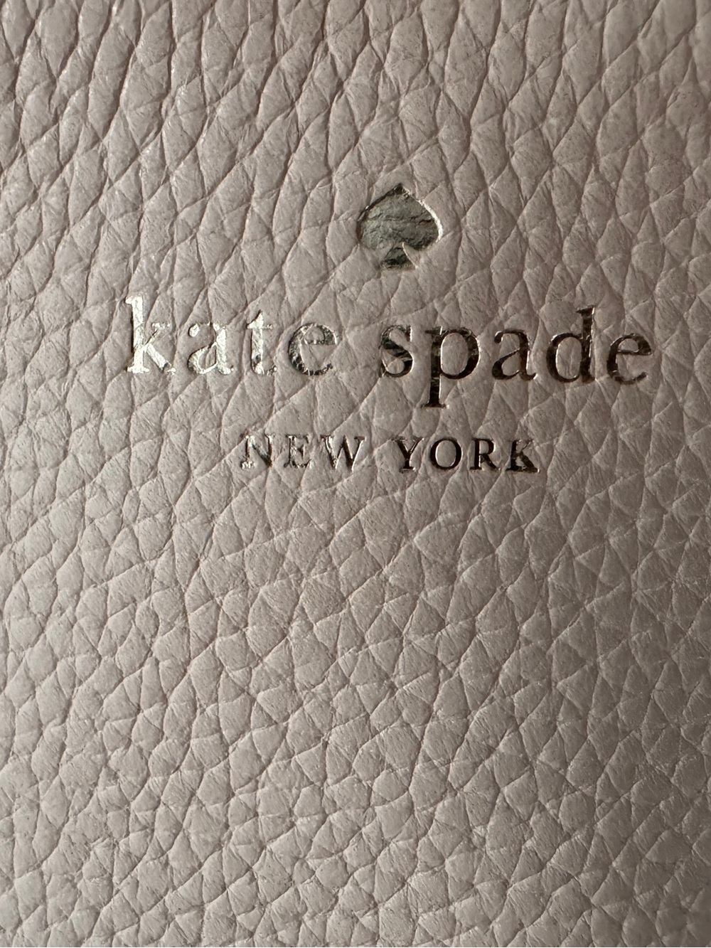 Kate Spade Pebbled Leather Wristlet in Off White